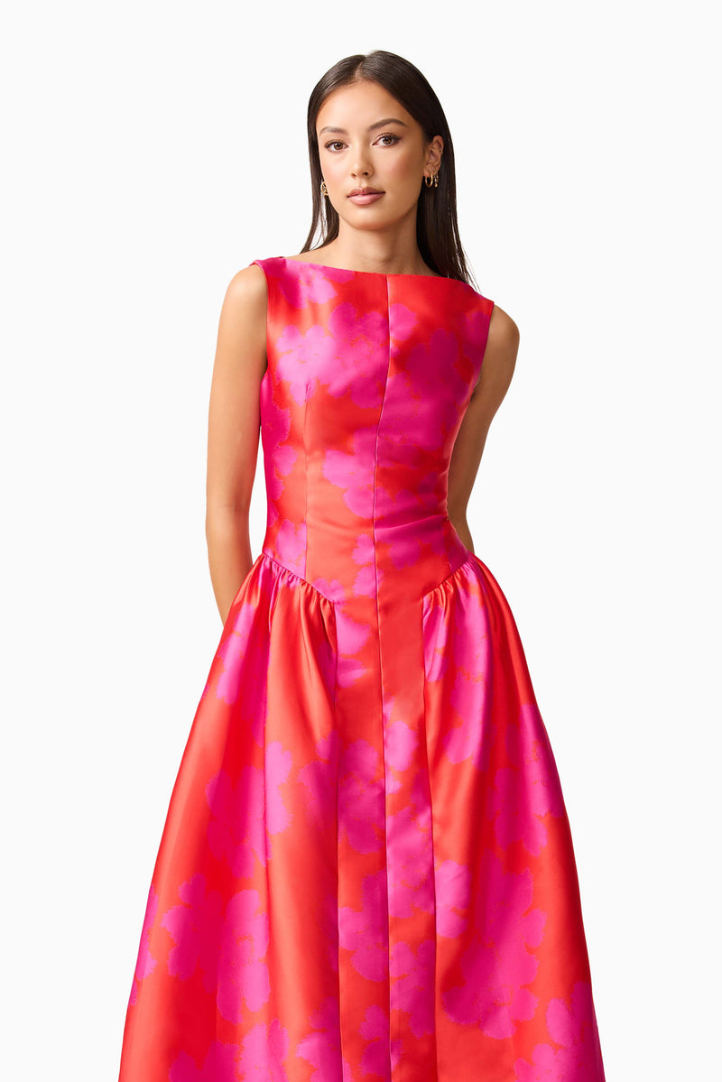 Brunette model wearing Eloise A-Line Midi Dress in Pink & Red close up shot