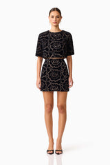 Brunette model wearing the Eris Short Sleeve Set in Black front shot 