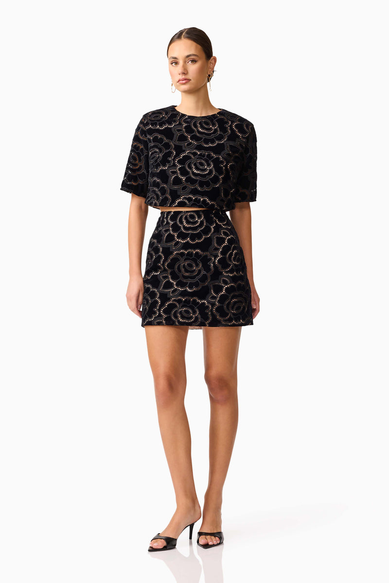 Brunette model wearing the Eris Short Sleeve Set in Black posed shot 