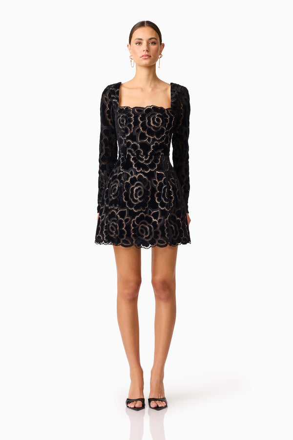 Brunette model wearing Eris Long Sleeve Mini Dress in Black front shot 