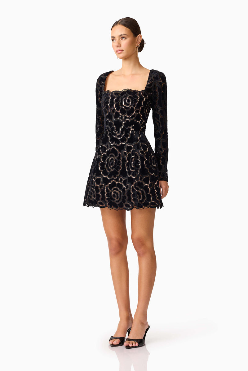 Brunette model wearing Eris Long Sleeve Mini Dress in Black side shot 