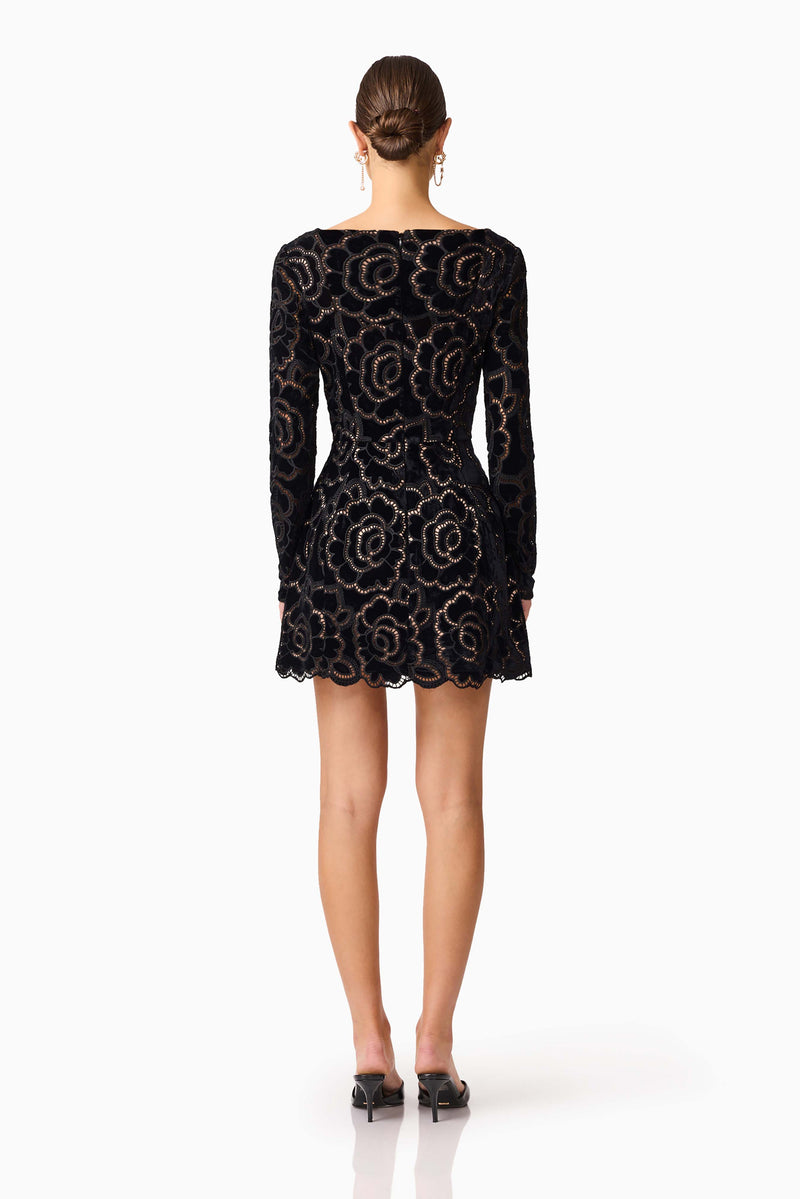 Brunette model wearing Eris Long Sleeve Mini Dress in Black back shot 