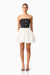 Brunette model wearing Eris Strapless Mini Dress in Black & White front shot