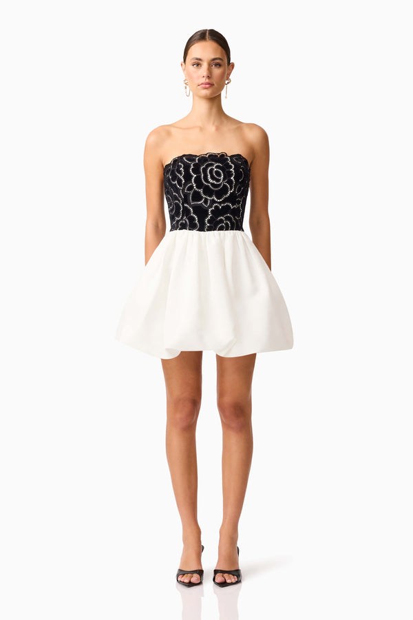 Brunette model wearing Eris Strapless Mini Dress in Black & White front shot