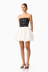 Brunette model wearing Eris Strapless Mini Dress in Black & White side shot