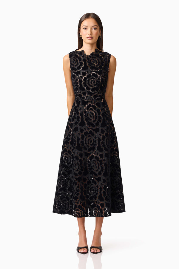 Brunette model wearing Eris Fit & Flare Midi Dress in Black front shot 