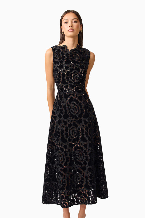 Brunette model wearing Eris Fit & Flare Midi Dress in Black close up shot 