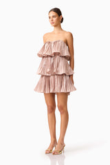 Brunette model wearing Lison Tiered Strapless Mini Dress in Pink side shot