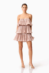 Brunette model wearing Lison Tiered Strapless Mini Dress in Pink posed shot