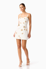 Brunette model wearing Mira Sweetheart Mini Dress in White posed shot 