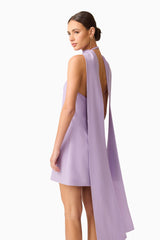 Brunette model wearing Mira Halter Mini Dress in Purple detail shot 