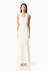 Brunette model wearing the Mira Halter Gown in White front shot 