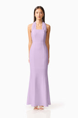 Brunette model wearing the Mira Halter Gown in Purple front shot 
