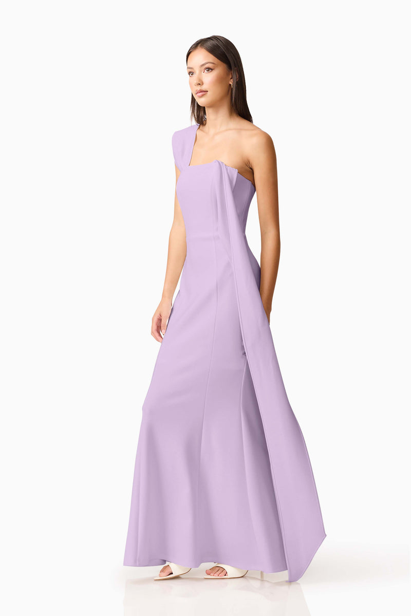 Brunette model wearing the Mira Halter Gown in Purple posed shot 