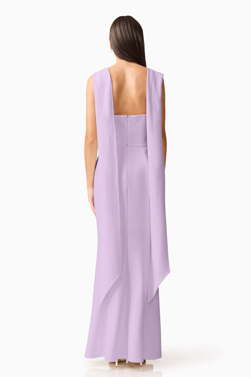 Brunette model wearing the Mira Halter Gown in Purple back shot 