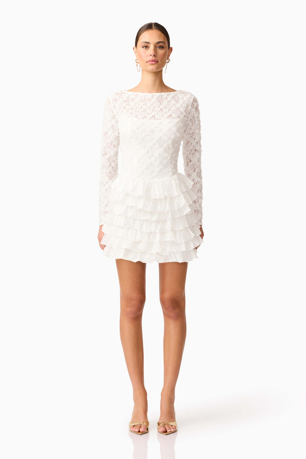 Brunette model wearing Athena Long Sleeve Lace Mini Dress in White front shot