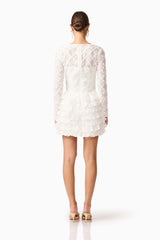 Brunette model wearing Athena Long Sleeve Lace Mini Dress in White back shot