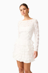 Brunette model wearing Athena Long Sleeve Lace Mini Dress in White close up shot