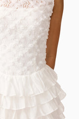 Brunette model wearing Athena Lace Midi Dress in White detail shot 