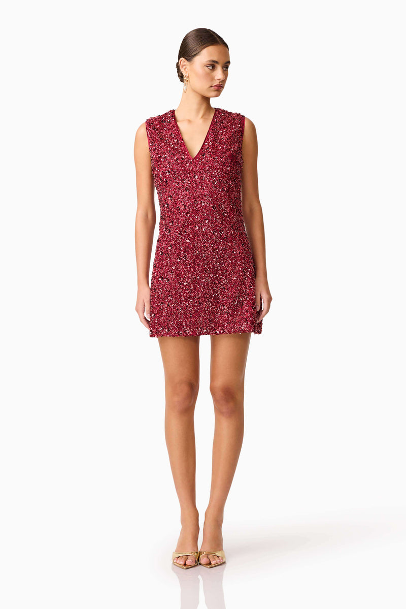 Brunette model wearing Carmen Shift Mini Dress in Red posed shot