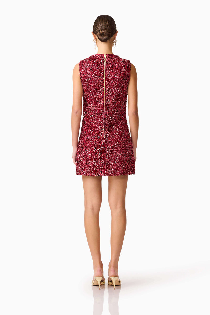 Brunette model wearing Carmen Shift Mini Dress in Red back shot