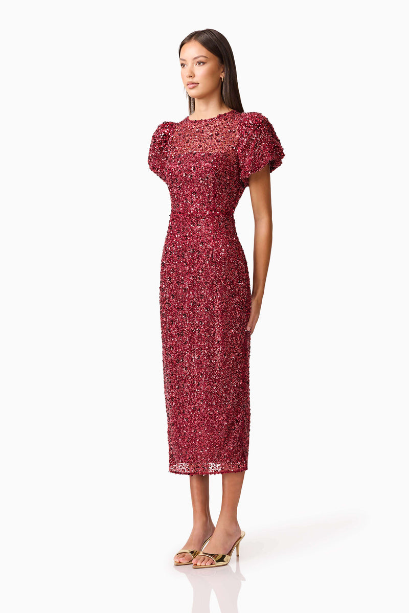 Brunette model wearing Carmen Puff Sleeve Midi Dress in Red side shot