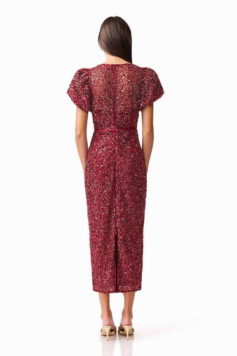 Brunette model wearing Carmen Puff Sleeve Midi Dress in Red back shot
