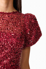 Brunette model wearing Carmen A-Line Mini Dress in Red detail shot