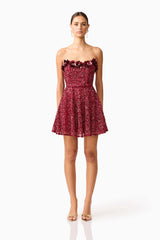 Brunette model wearing Carmen A-Line Mini Dress in Red front shot