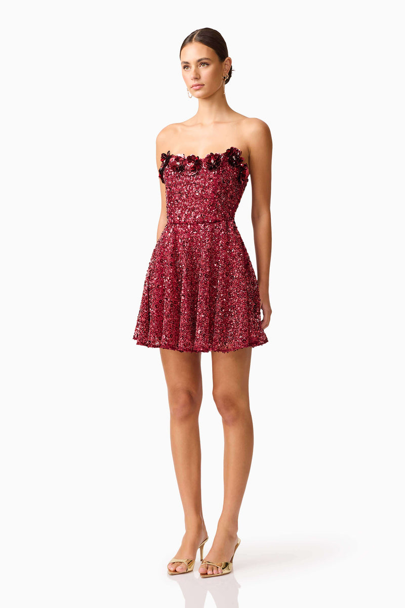 Brunette model wearing Carmen A-Line Mini Dress in Red side shot