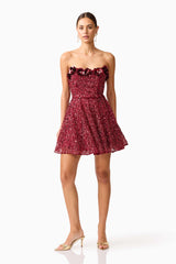 Brunette model wearing Carmen A-Line Mini Dress in Red posed shot