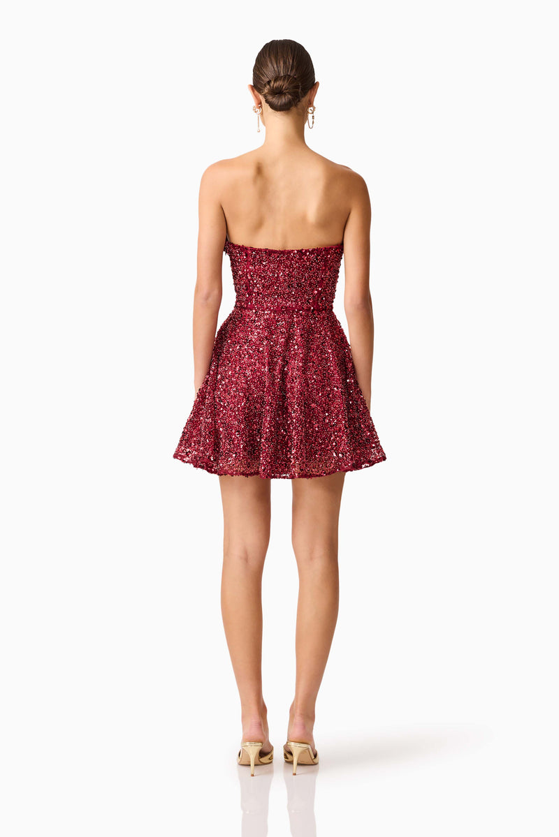 Brunette model wearing Carmen A-Line Mini Dress in Red back shot