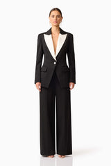 Brunette model wearing the Leonie Wide Leg Pants In Black front shot