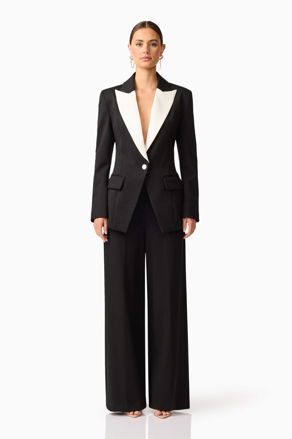 Brunette model wearing the Leonie Wide Leg Pants In Black front shot