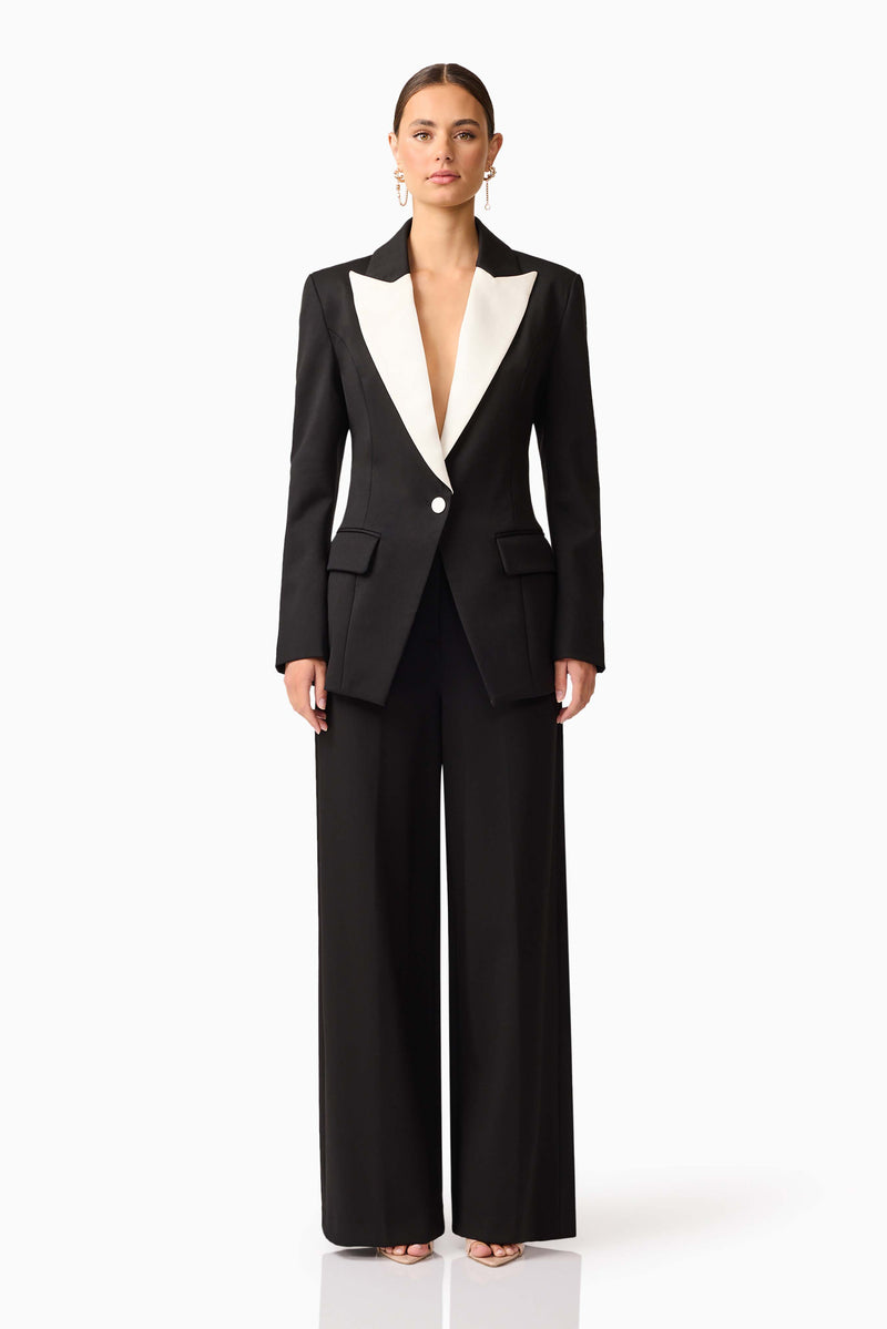 Brunette model wearing the Leonie Wide Leg Pants In Black front shot