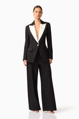Brunette model wearing the Leonie Wide Leg Pants In Black posed shot