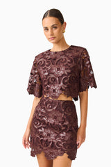 Novelle Top & Mini Skirt Set in Chocolate Brown with round neckline & scalloped hem close up shot