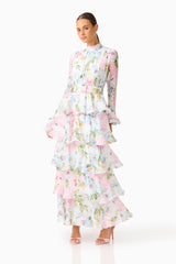 Florisee Tiered Maxi Dress in Blue & Pink Floral with long sleeves & collar neckline posed leaning shot