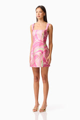 Brunette model wearing the Mirella Fitted Mini Dress in Pink side shot