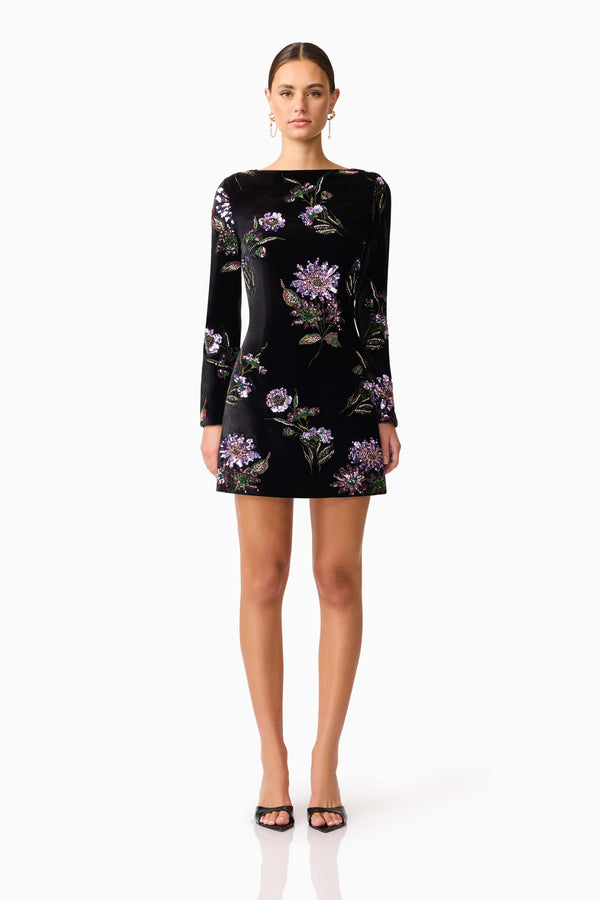 Brunette model wearing the Clio Long Sleeve Mini Dress in Black front shot