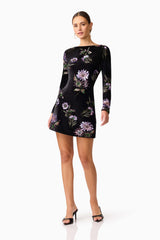 Brunette model wearing the Clio Long Sleeve Mini Dress in Black posed shot