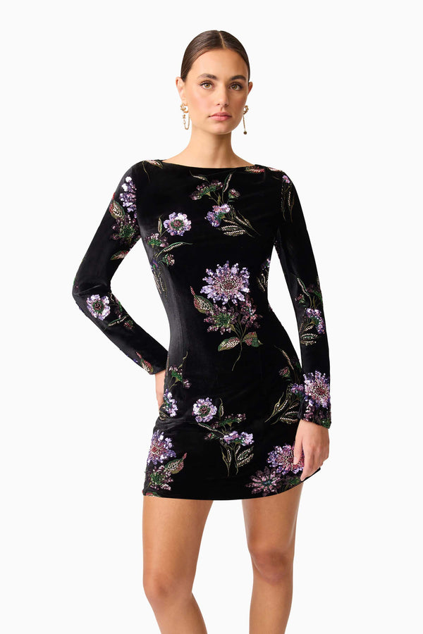 Brunette model wearing the Clio Long Sleeve Mini Dress in Black close up shot