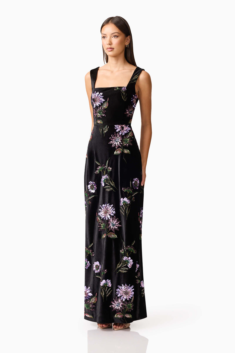 Brunette model wearing the Clio Sequin Gown in Black side shot