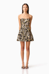 Brunette model wearing the Celeste Strapless Mini Dress in Black and Gold front shot