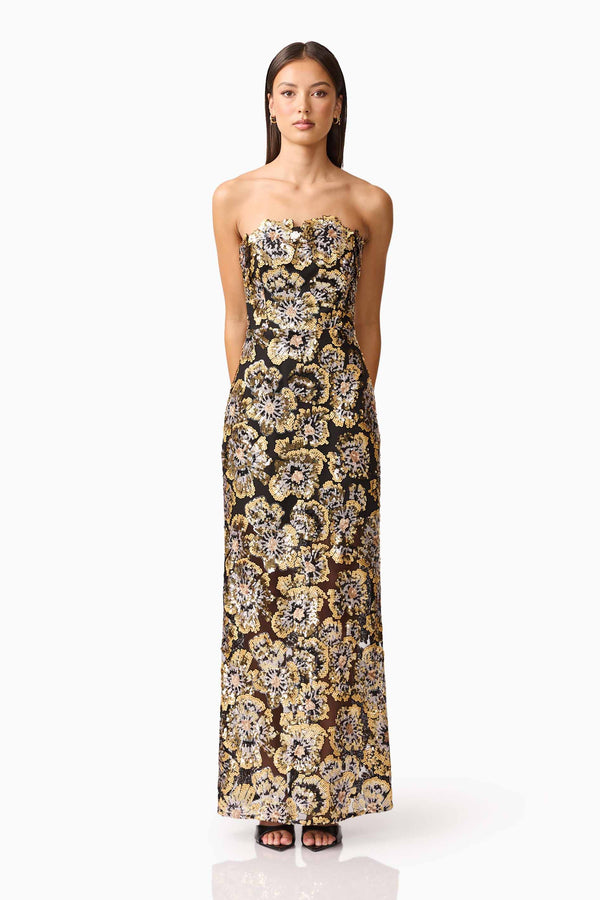 Brunette model wearing the Celeste Strapless Gown in Black and Gold front shot