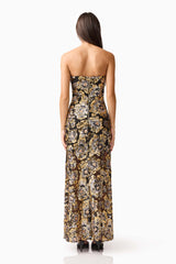 Brunette model wearing the Celeste Strapless Gown in Black and Gold back shot