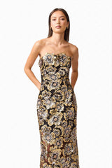 Brunette model wearing the Celeste Strapless Gown in Black and Gold close up shot