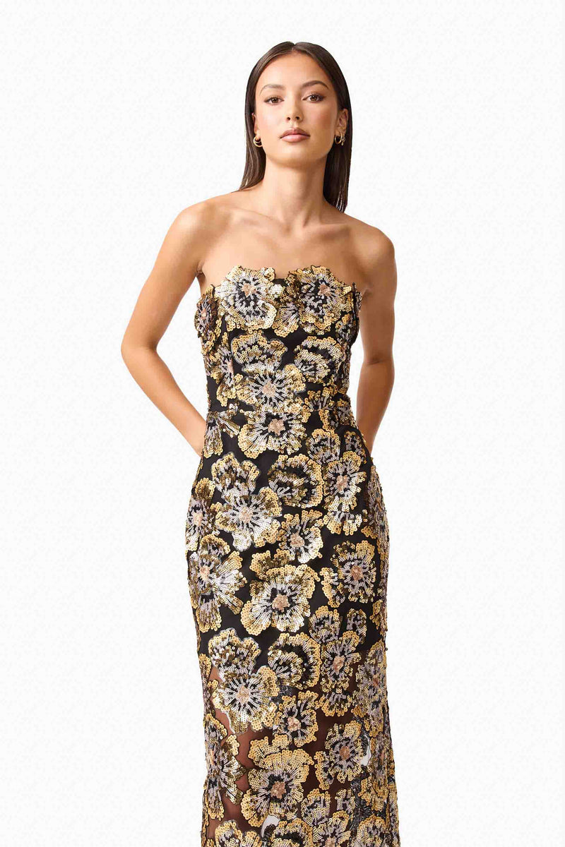 Brunette model wearing the Celeste Strapless Gown in Black and Gold close up shot