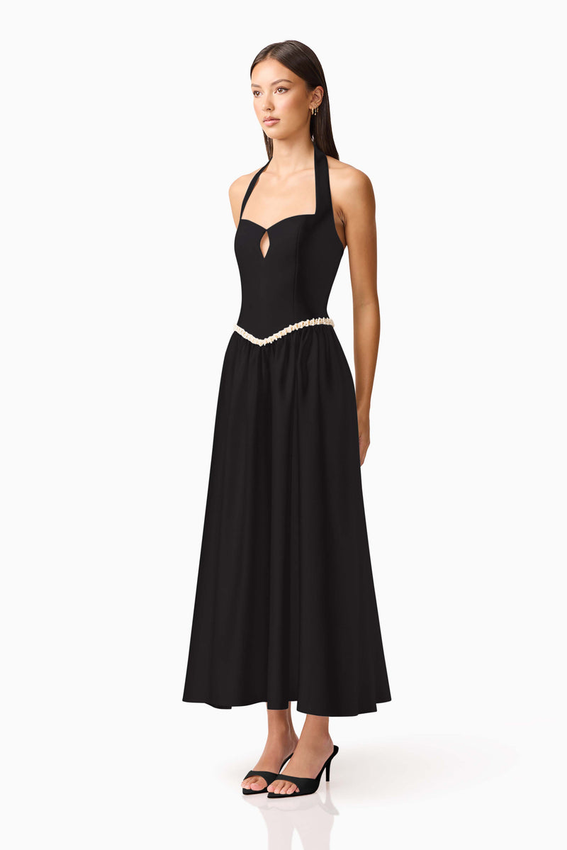 Brunette model wearing Hester Halter Gown in Black side shot