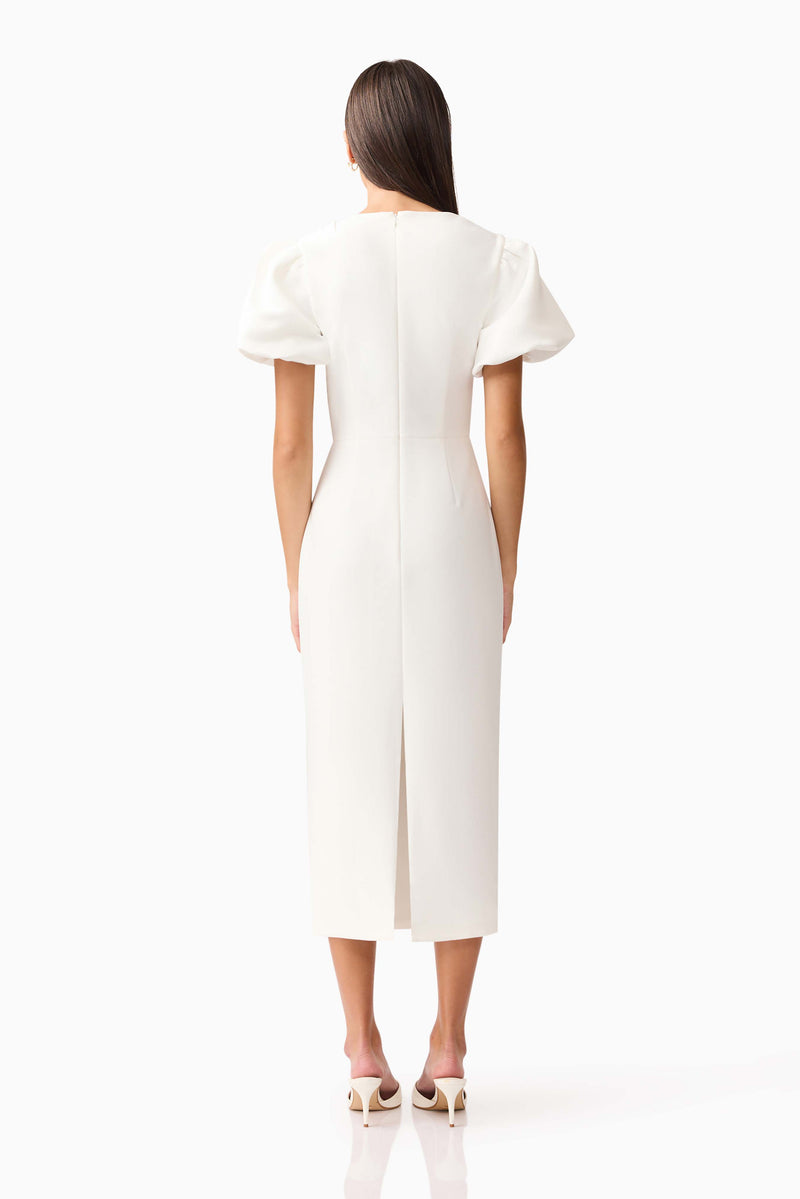 Brunette model wearing the Hester Puff Sleeve Midi Dress in White back shot